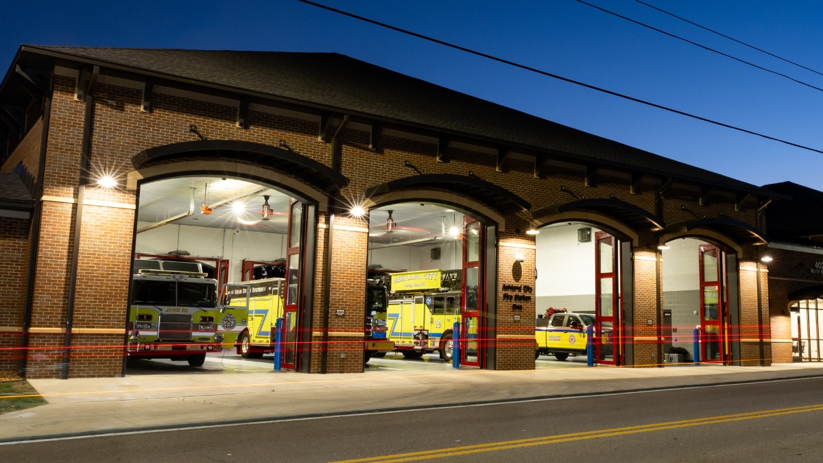 Ashland City Fire Department station with fire trucks visible inside the open bays
