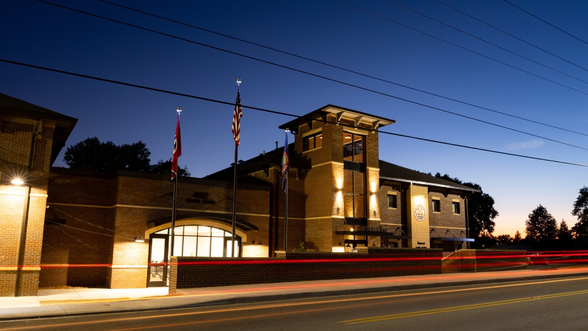 Ashland City Fire Department station at night with red and white traffic light trails