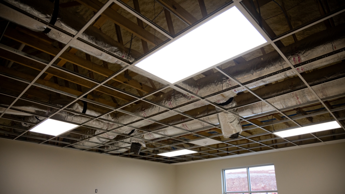 LED ceiling panels installed in a suspended grid during commercial construction