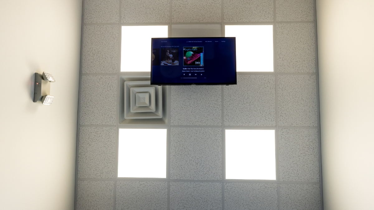 Ceiling-mounted television and overhead lighting in an Ironwood Dental treatment room