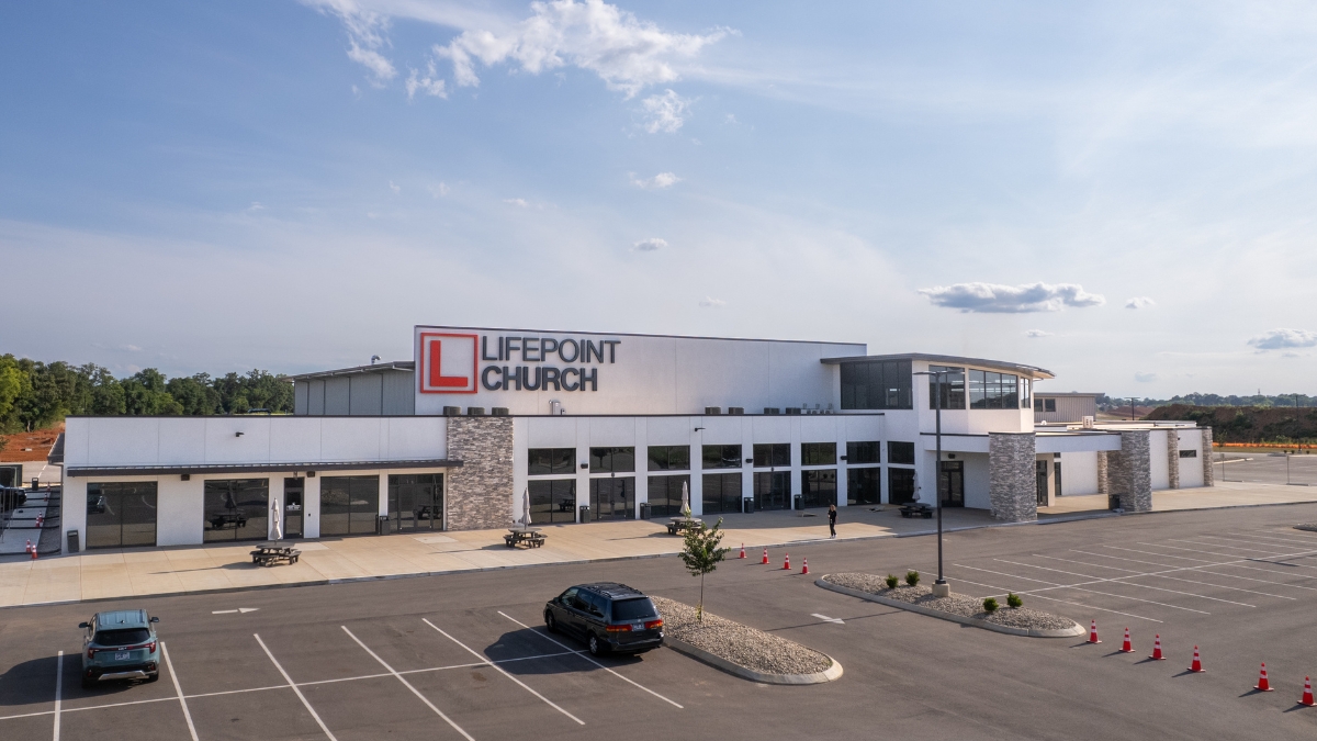 Aerial view of LifePoint Church exterior and parking area during the day