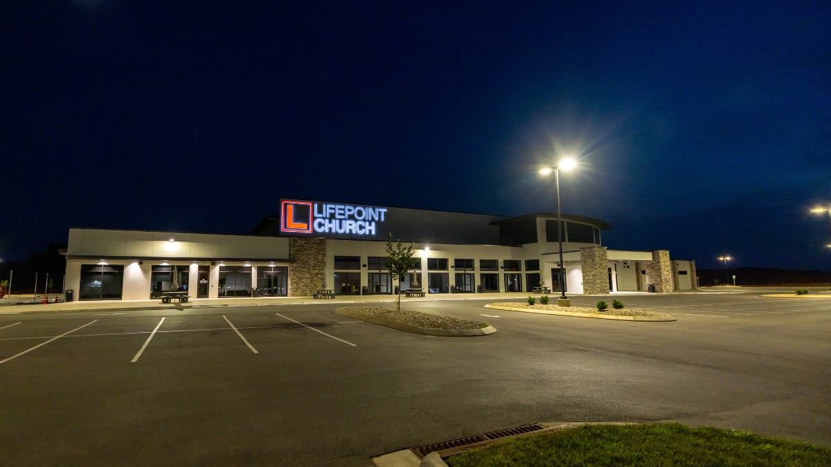 LifePoint Church exterior and illuminated parking lot at night