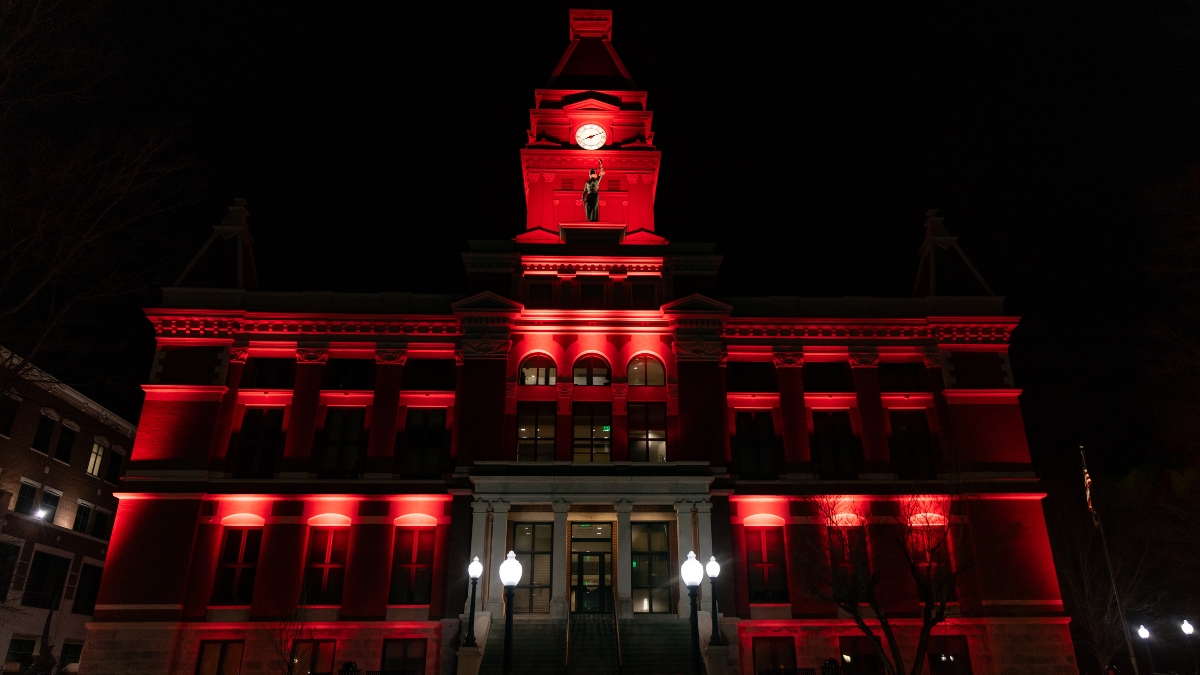 Montgomery County Courthouse illuminated in red at night