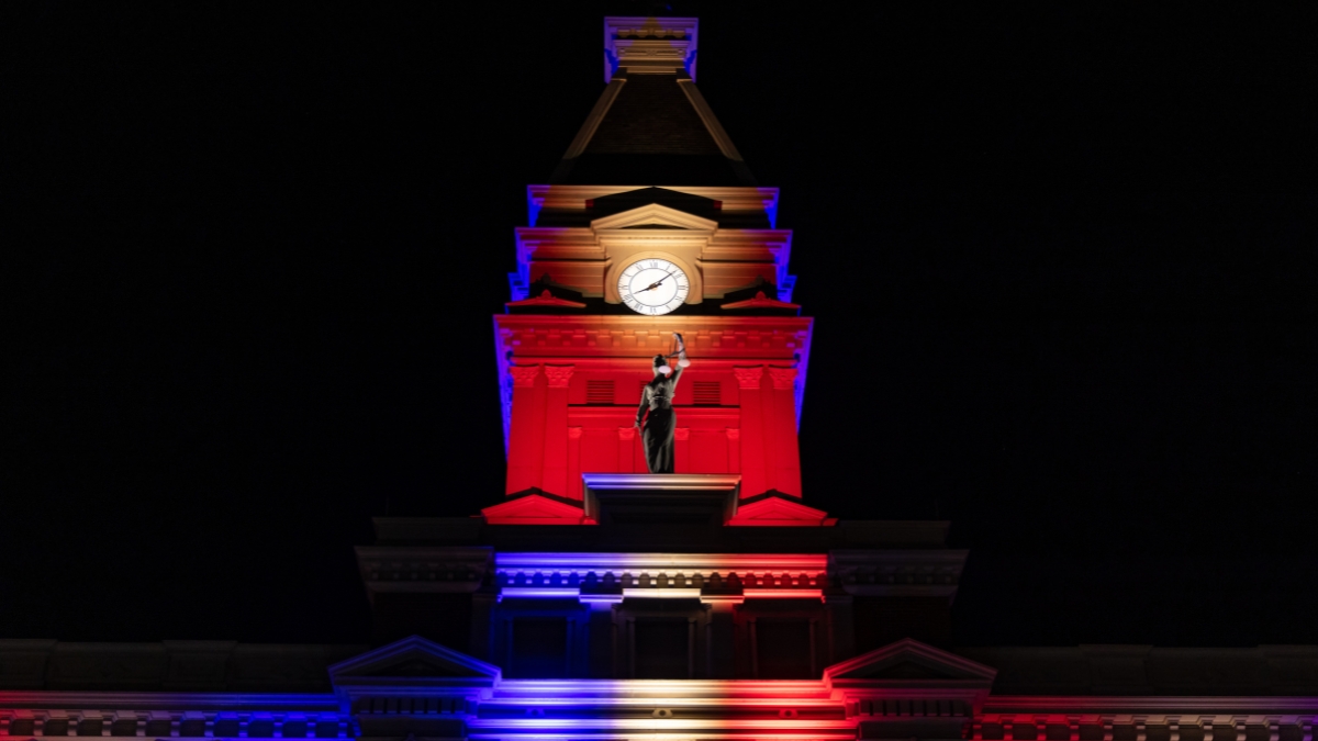 Montgomery County Courthouse clock tower illuminated in red, white and blue