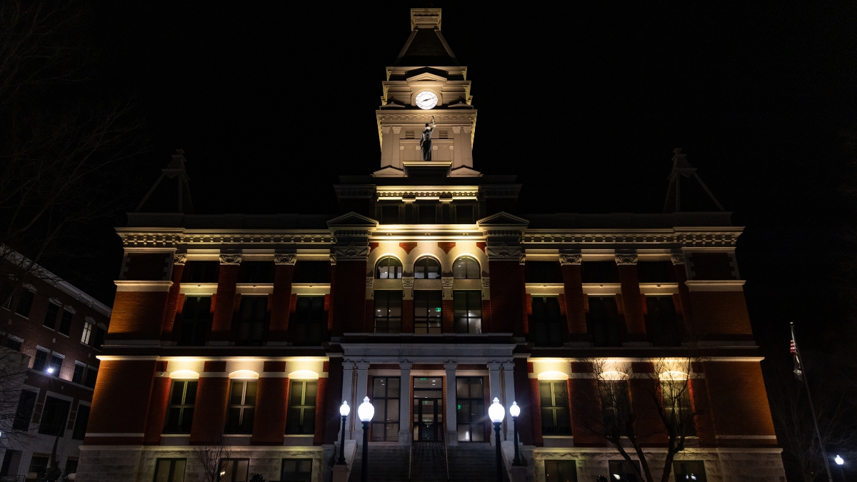 Montgomery County Courthouse illuminated with warm white lights at night