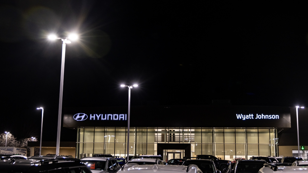 Wyatt Johnson Hyundai dealership exterior and vehicle lot illuminated at night